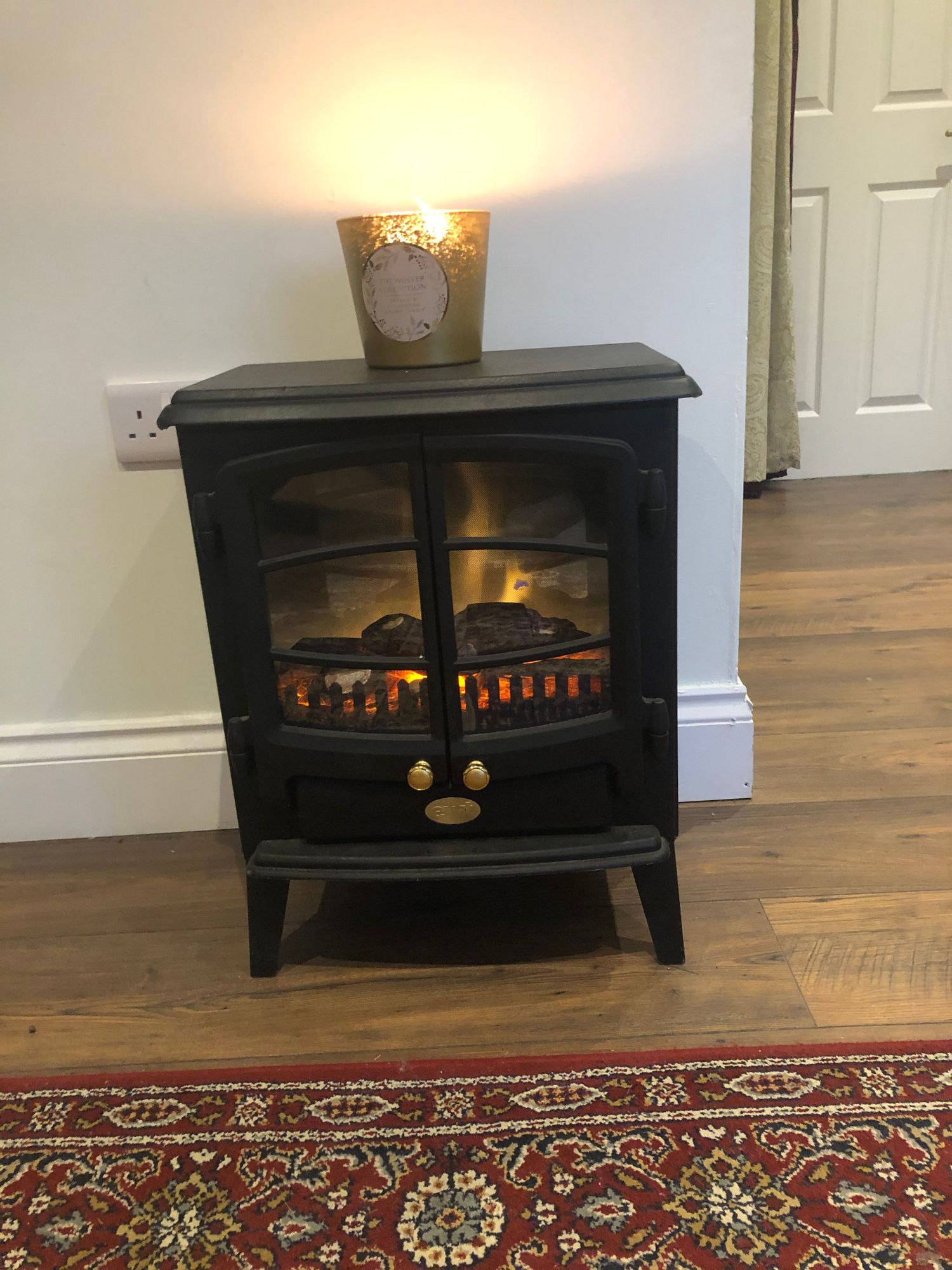 Warm electric fireplace creating a cozy, therapeutic atmosphere